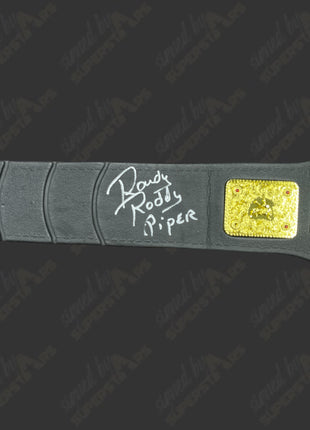 Rowdy Roddy Piper, Hulk Hogan & Billy Graham triple signed WWE World Heavyweight Toy Belt