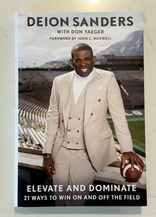 Deion Sanders signed Elevate and Dominate Book