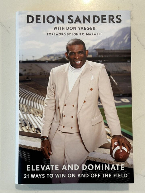 Deion Sanders signed Elevate and Dominate Book