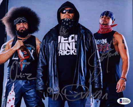 Konnan, Ortiz & Santana triple signed 8x10 Photo (w/ Beckett)