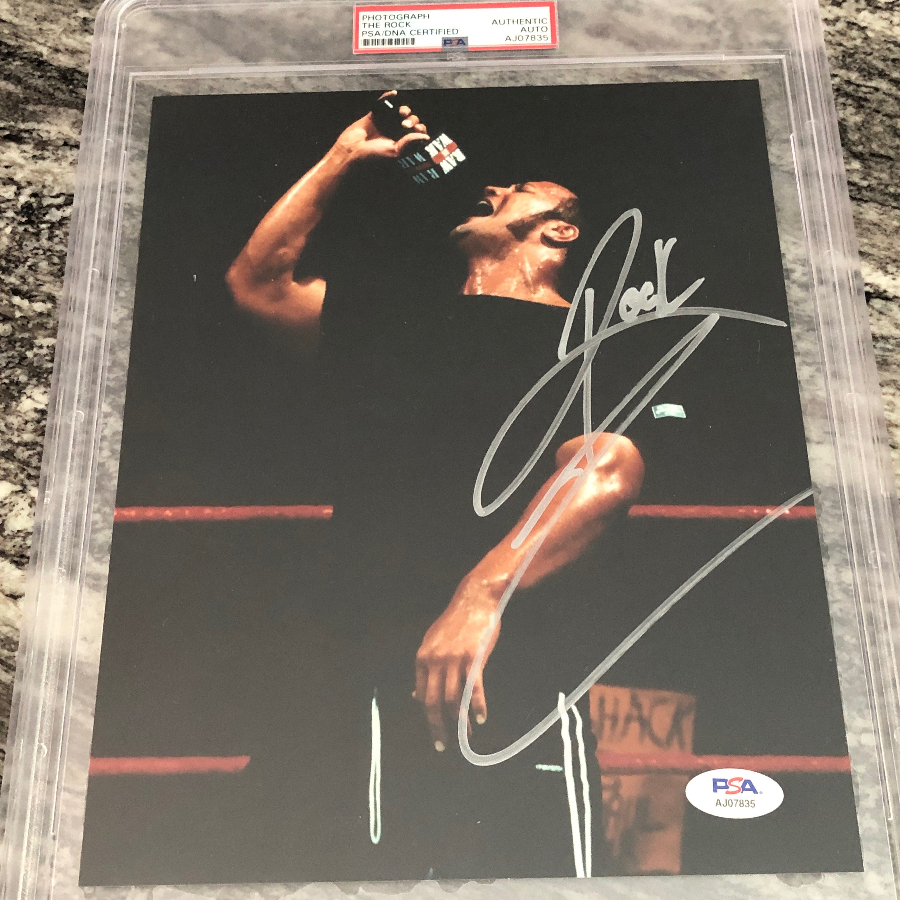 Robert Rocks Signed The Rock signed 8x10 Photo (Encapsulated w/ PSA-DNA) – Signed By Superstars